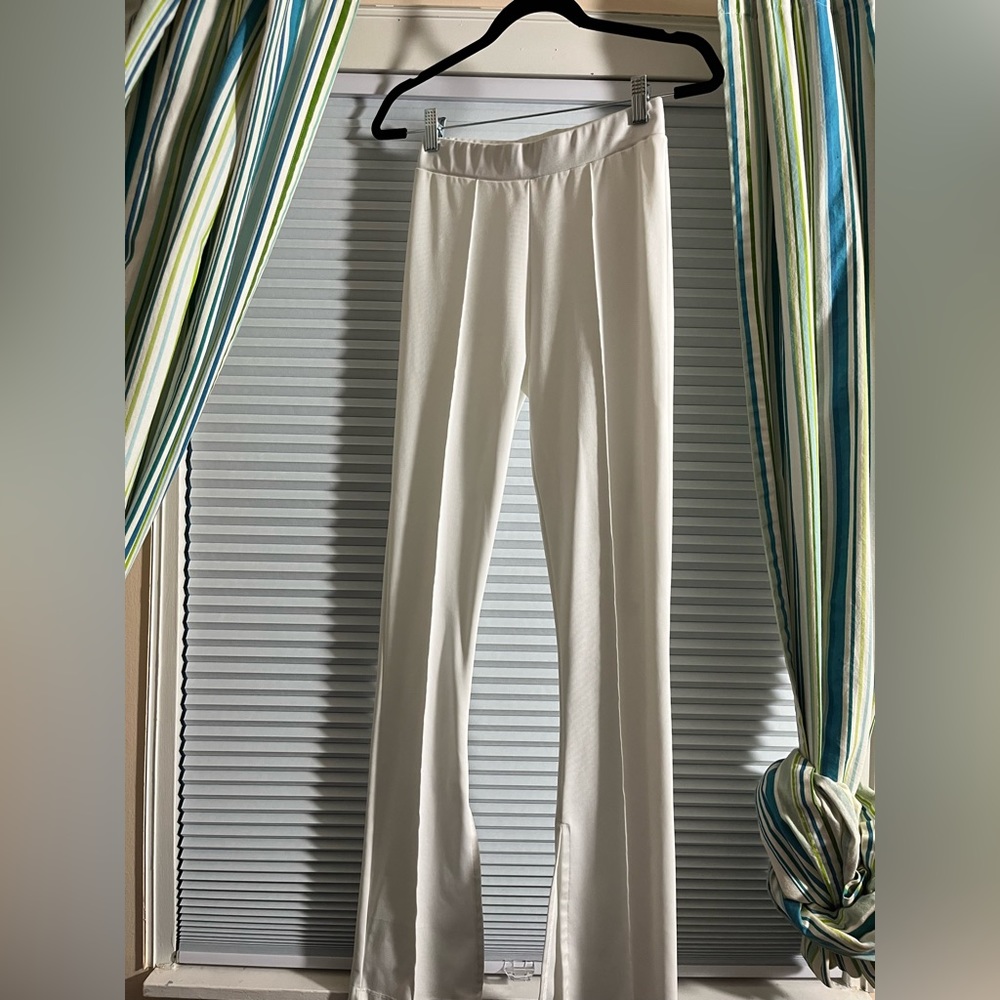 White dress pants w/split bottom.